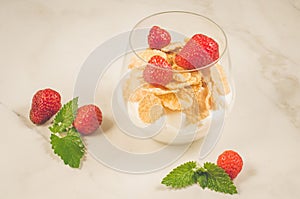 Smoothies with corn flakes decorated mint and strawberry/ Smoothies with corn flakes decorated mint and strawberry on white table