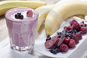 Smoothies of frozen raspberries, blueberries and banana with yo