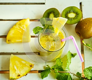 Smoothies of kiwi and pineapple on the table. Top view