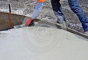 Smooting out the concrete after the cement is poured