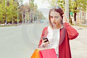 SMS. Closeup portrait funny shocked anxious scared young girl Lady looking at phone seeing bad news photos bully message with photo