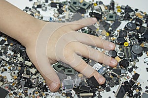 SMT components and a child hand in them.