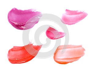 Smudged lipgloss samples isolated on white