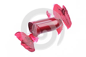 Smudged lipstick over white background.