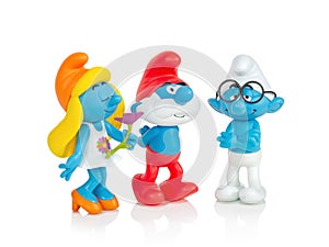 The Smurfs - Smurfette, Pappa Smurf and Brainy toys isolated on white background with shadow reflection. Smurfs toy figure model