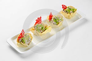 Snack baskets on a glass plate. Catering service