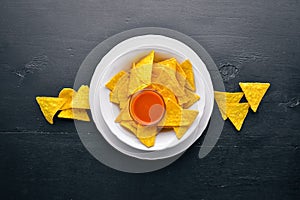 Snack for beer. Chips On a wooden background.