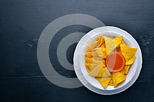 Snack for beer. Chips On a wooden background.