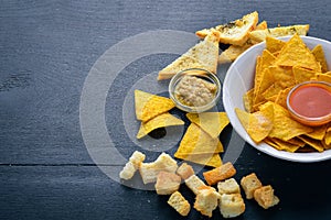 Snack for beer. Chips On a wooden background.