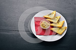 Snack for beer. On a wooden background.