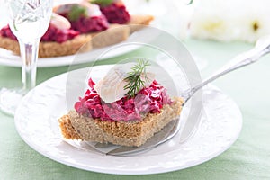 Snack from beetroot and herring
