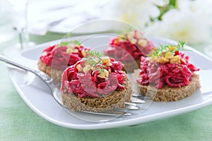 Snack from beetroot and walnuts