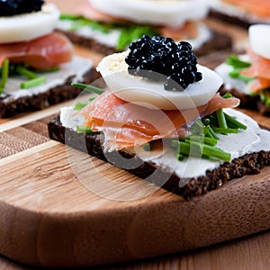 Snack with caviar and salmon