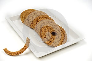 Snack Chakli, a spiral shaped crisp deep fried snack, It is known as Chakali, Murukku,