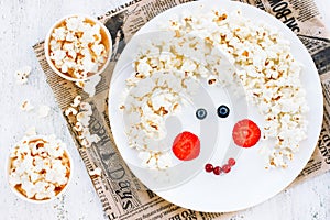 Snack or dessert for baby girl - sweet popcorn with strawberry a