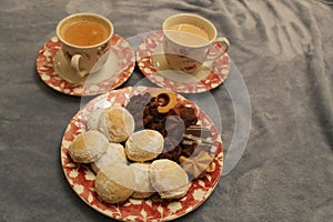 Snack in Eastern countries with Egyptian cookies and tea.