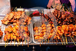 Snack and fried chicken stall at a market in Asia