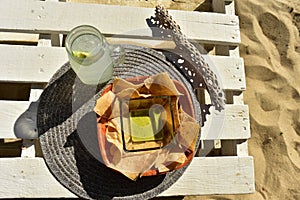 Snack of green salsa, tortilla chips, and lemonade