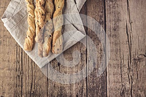 Snack of Grissini Bread Sticks on a Wooden Background Tapas Bar Homemade Bread Sticks Flat Layuot Copy Space