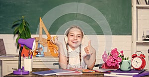 Snack between lessons. Schoolgirl sit desk chalkboard background. Healthy lifestyle. School life concept. Modern