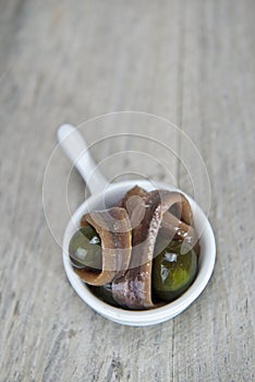 Snack made of anchovies and olives