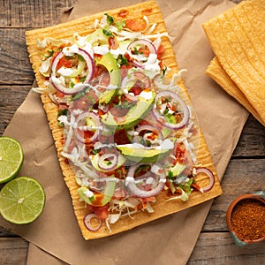 Snack made with wheat flour called chicharron preparado with sauce and vegetables. Mexican food photo