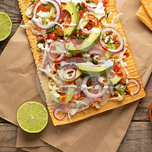 Snack made with wheat flour called chicharron preparado with sauce and vegetables. Mexican food photo