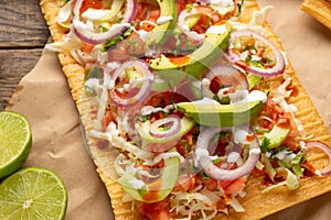 Snack made with wheat flour called chicharron preparado with sauce and vegetables. Mexican food photo