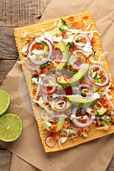 Snack made with wheat flour called chicharron preparado with sauce and vegetables. Mexican food photo