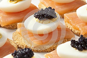 Snack with salmon,quail eggs and lumpfish roe