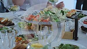 Snack table. Canape with vegetables and cheese, Served table with food. Lots of snacks on the holiday table. Banquet