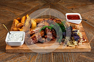 Snacks for beer are on a wooden tray. October fest