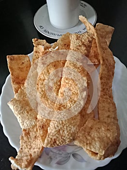 Snacks made of cassava flour with salt, onion and chilies to accompany coffee.