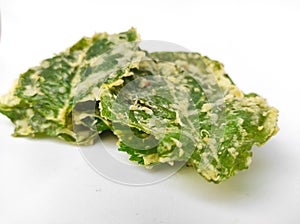 Green spinach chips isolated on white