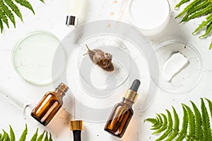 Snail mucin products at white background. Natural cosmetic.