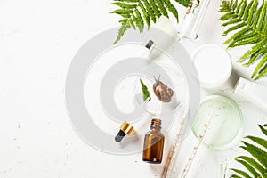 Snail mucin products at white background. Natural cosmetic.