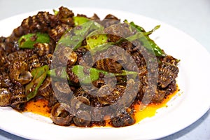 Snail sauteed with curry sauce