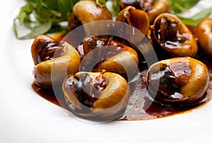 Snails cooked in tamarind sauce with herbs