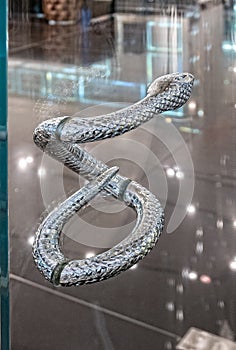 Snake door handle, retail store