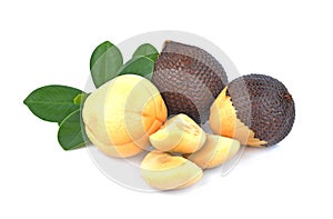 Snake fruit,Salacca,zakacca Salak Indo with green leaves isolated on white background