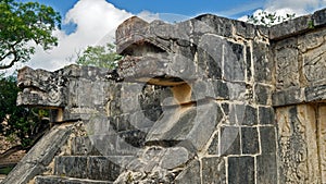 Snake stone head in the Yucatan jungle