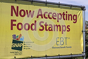 SNAP and EBT Accepted here sign. SNAP and Food Stamps provide nutrition benefits to help the budgets of disadvantaged families.