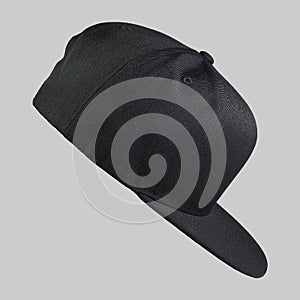 Snapback cap black color in side view isolated on grey background
