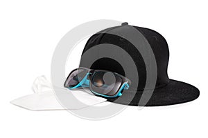 Snapback cap, sunglasses and a face mask