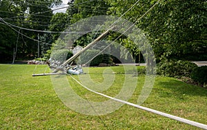 Snapped and downed power post and line after storm