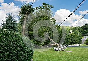Snapped and downed power post and line after storm photo