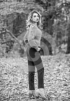 Snapping memories. feeling romantic in fall forest. sexy woman red lipstick nature background. warm and cosy seasonal