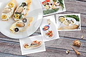 Snapshots of various sandwiches with seafood arranged on rustic wooden background with plates with food and seashells