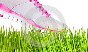 Sneaker stepping on grass