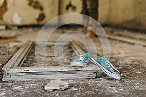 Sneakers in an abandoned building